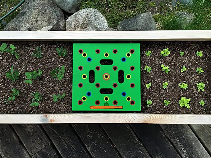 Seeding square tool to help with square foot gardening.